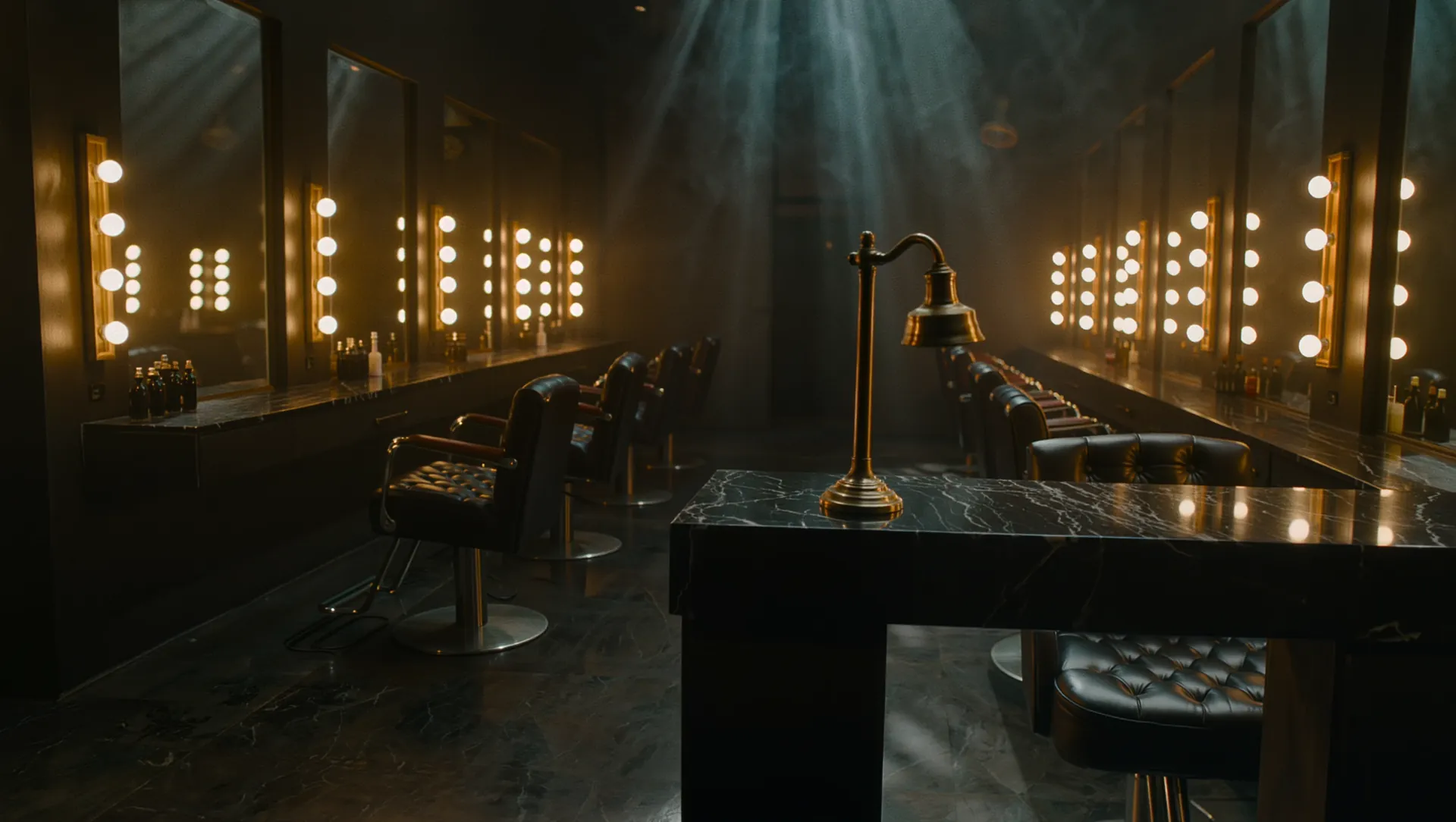 The Ash & Aurum floor at night, lit by brass sconces.
